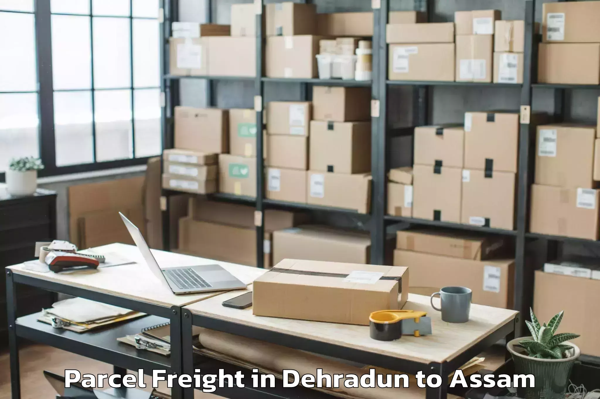 Book Your Dehradun to Makum Parcel Freight Today